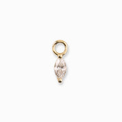 Gold pendant with a clear gemstone on a white background