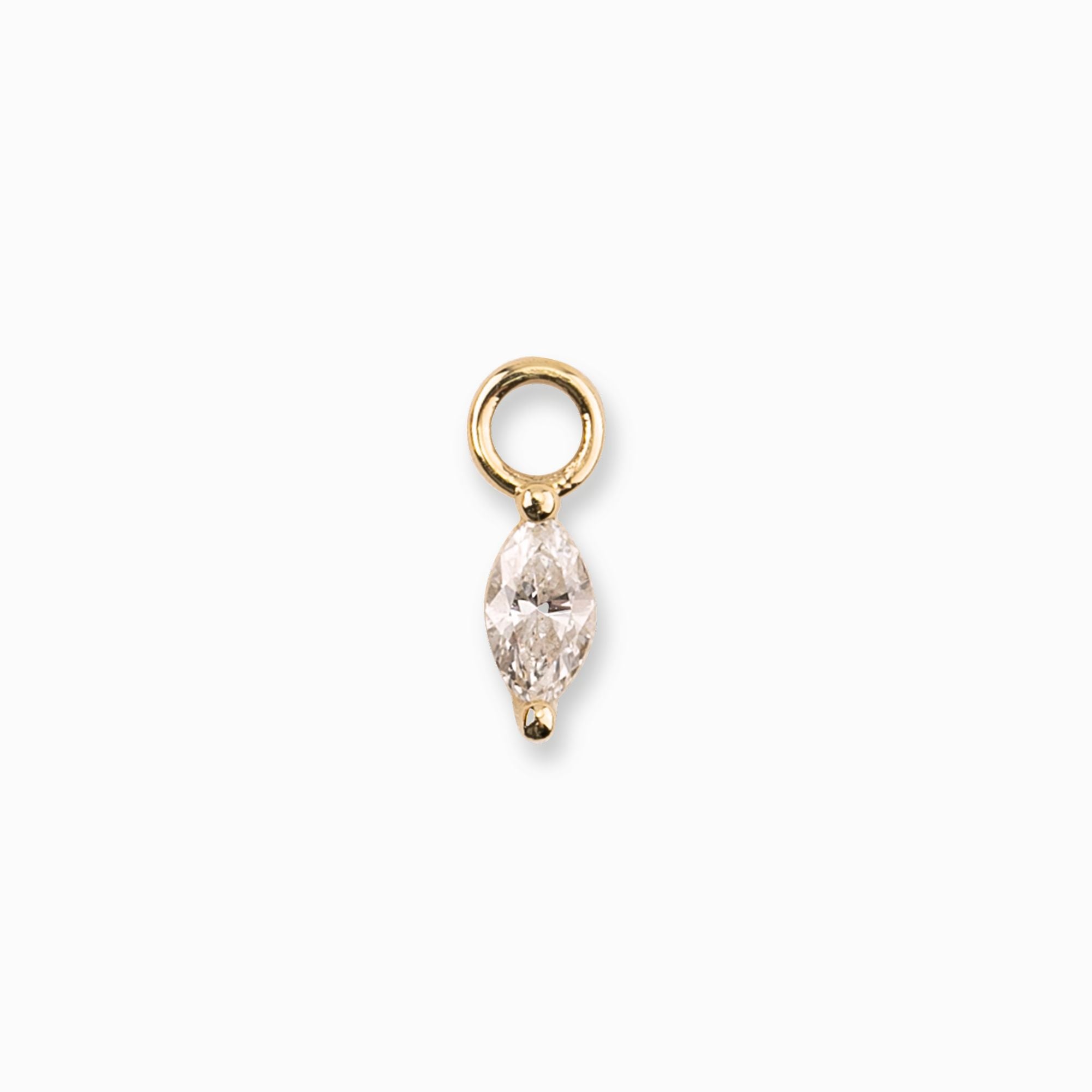 Gold pendant with a clear gemstone on a white background