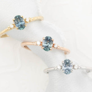 Three Estel Ring featuring a 0.60ct blue-green oval Montana sapphire and natural diamond accents, 14k solid gold rings