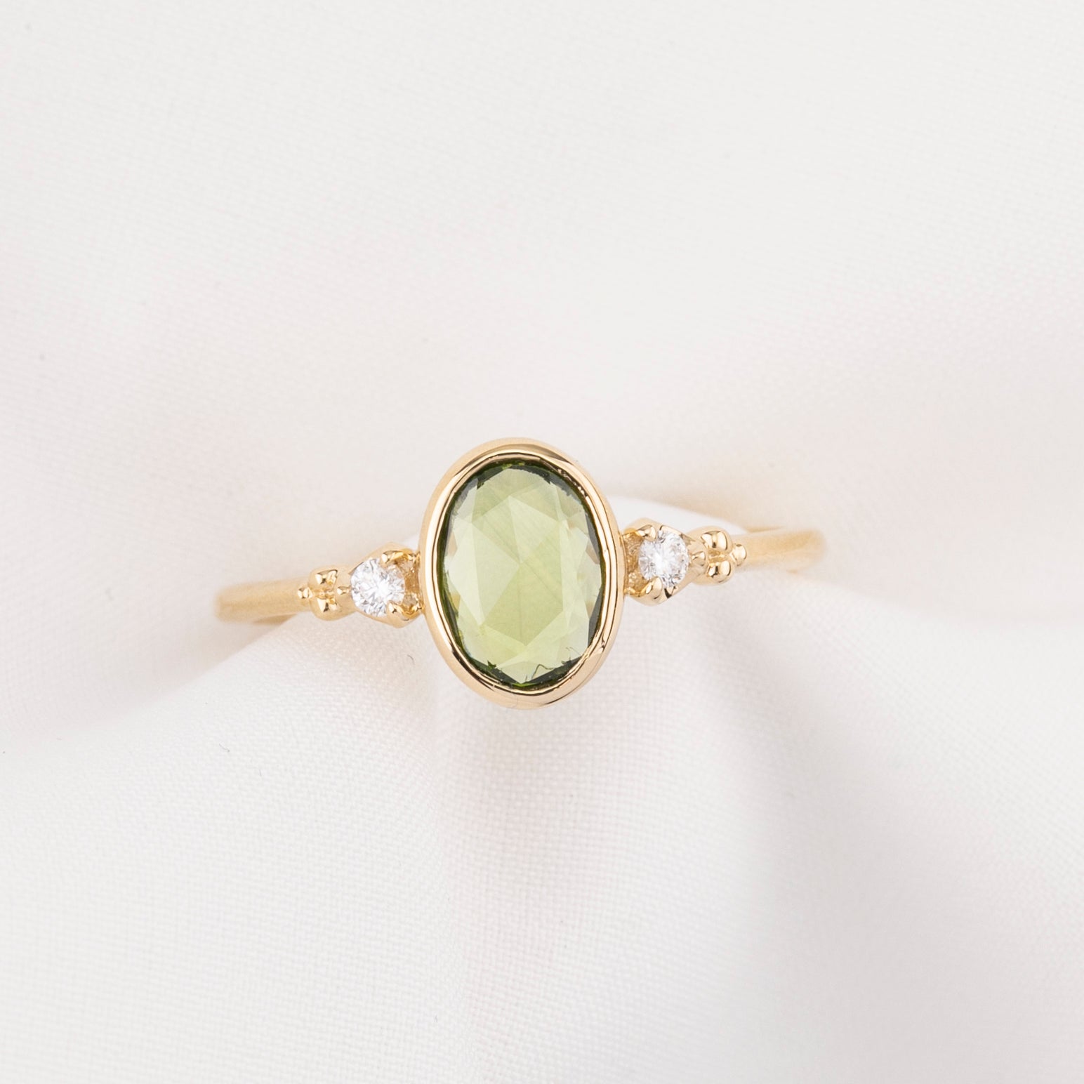 Estel Bezel Ring, 0.60ct Green Sapphire, oval shape gemstone