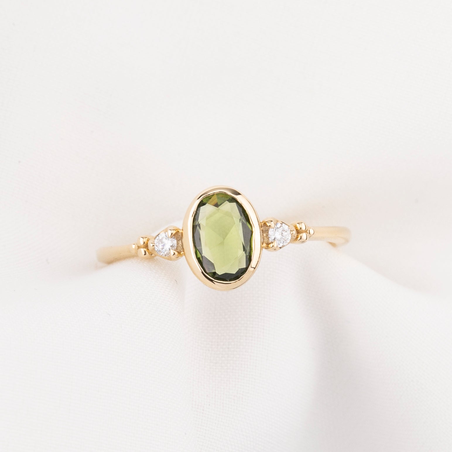 Estel Bezel Ring, 0.60ct Green Sapphire, oval shape gemstone