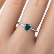 Close-up of Jane Ring with 1.18ct blue-green Montana sapphire in a classic four-prong solid gold setting