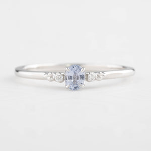Estel Ring featuring a 0.20ct light blue unheated oval sapphire and 14k white gold diamond accents