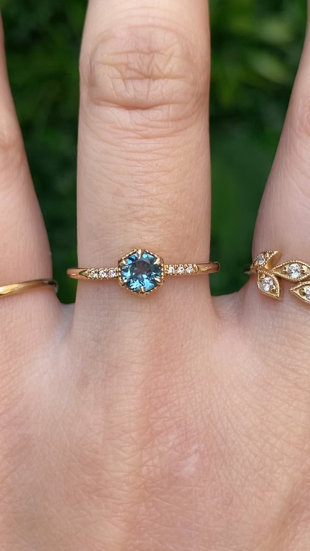 Hexagon ring with a teal blue sapphire and natural diamond accents in 14k yellow gold 