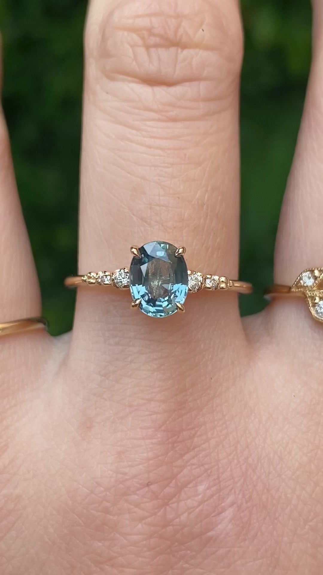 14k gold ring featuring a 1.27ct Montana oval sapphire with diamond side stones—timeless sparkle with an elegant silhouette.