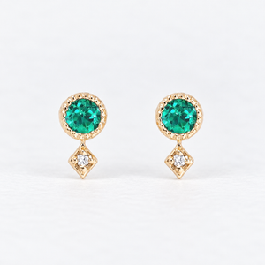 14K yellow gold stud earrings with round green gemstones and natural diamond accents