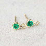 14K yellow gold stud earrings with round green gemstones and natural diamond accents