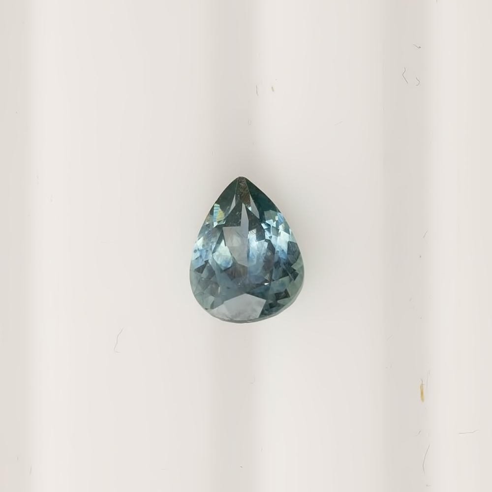 1.41ct pear shape Montana sapphire blue green gem measuring 8.04x6.03x3.91mm with medium teal color