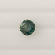 1.58ct round cut green Montana sapphire with slight blue tint, ethically sourced and authentic gemstone from Montana, USA.