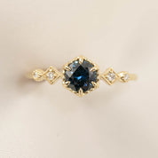 14k gold Stella Ring with 0.7ct peacock sapphire and diamond accents in hexagonal bezel setting