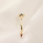 Side view of Stella Ring featuring 0.7ct Queensland sapphire and white diamonds in 14k gold band