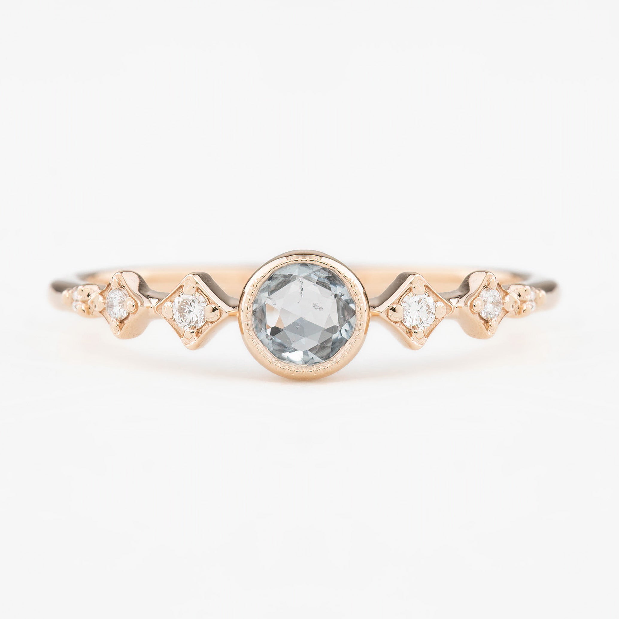Celeste Ring, 0.25ct Round Unheated Sapphire set in 14k rose gold with natural accent diamonds