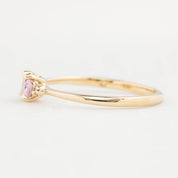 Side view of Emilie Ring featuring a 0.45ct East-West unheated Umba sapphire in 14k yellow gold.