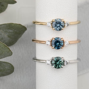 Emilie Ring featuring a 0.60ct round Montana sapphire in 14k yellow gold, rose gold and white gold.