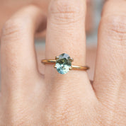 1.61ct Oval Cut Parti Aqua Green & Lime Green Montana Sapphire ring on finger, handmade authentic jewelry