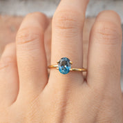 1.89ct Oval Cut Parti Blue Green Sapphire ring on finger, handmade and ethically sourced from Montana, USA by Envero Jewelry