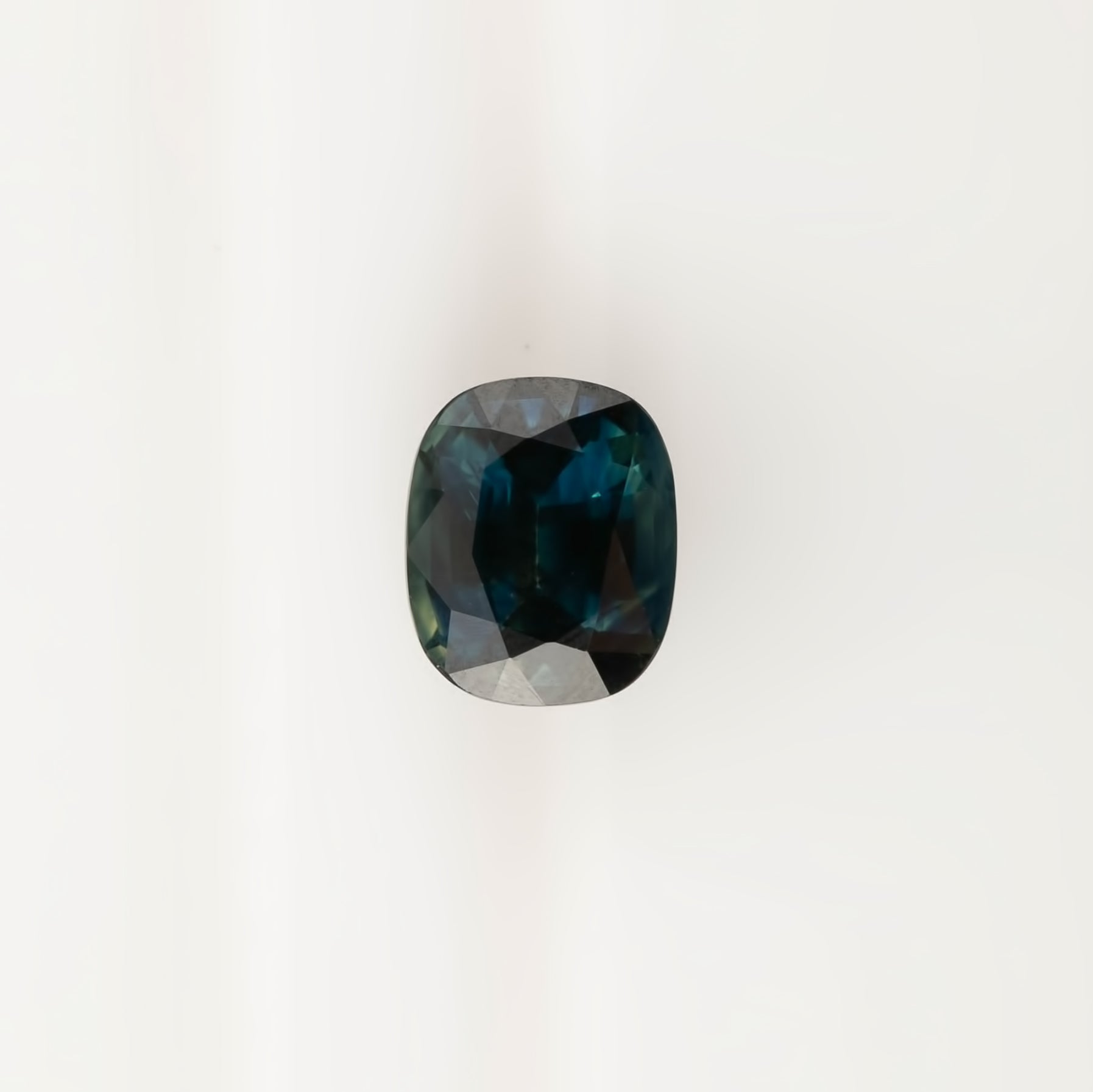 3.39ct cushion cut teal sapphire from Sri Lanka with VVS clarity and very good luster, heat treated, measuring 9.3x7.7mm