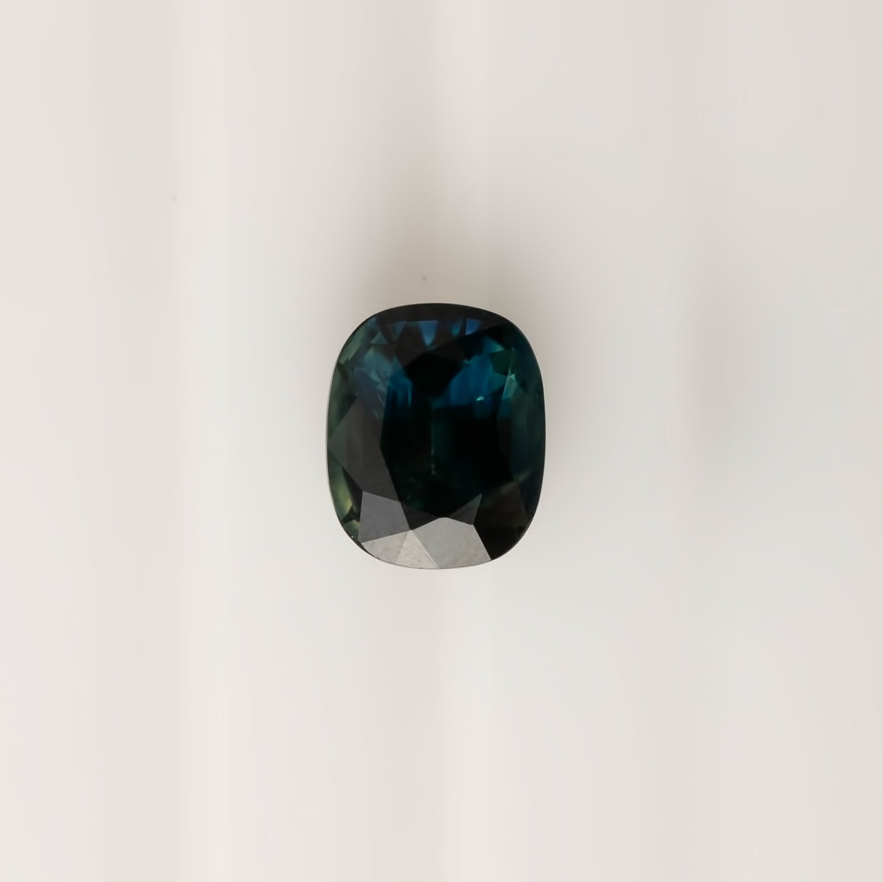 3.39ct cushion cut teal blue sapphire gemstone from Sri Lanka, VVS clarity, 9.3x7.7mm, heat treated, very good luster